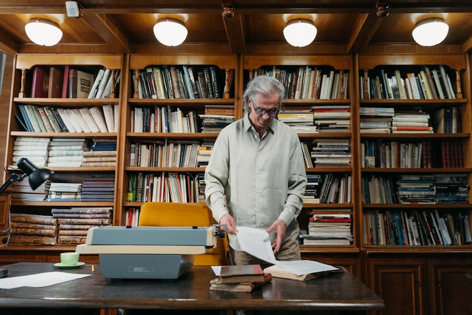 Elderly man browsing historical books in a well-stocked library, symbolizing knowledge.